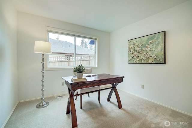office with baseboards, carpet flooring, and visible vents
