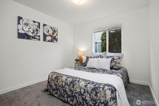 carpeted bedroom featuring baseboards