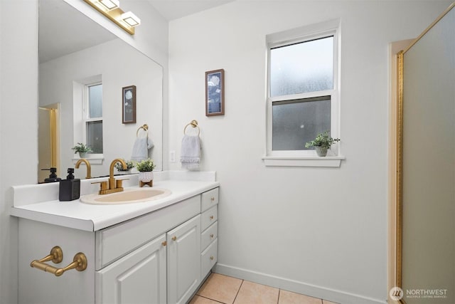 bathroom featuring baseboards, vanity, and tile patterned floors