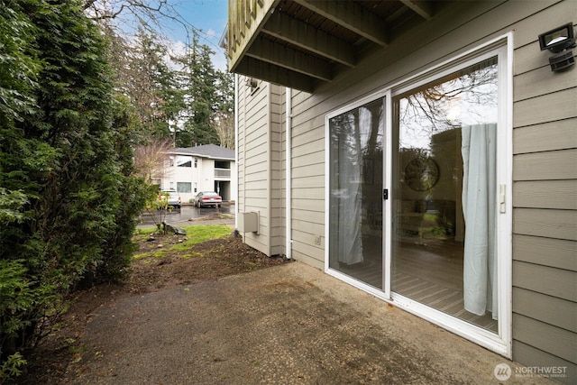view of side of property with a patio