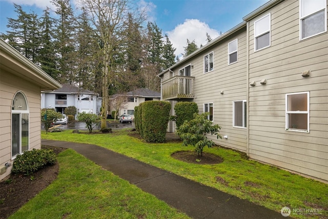 view of property's community with a yard and a residential view