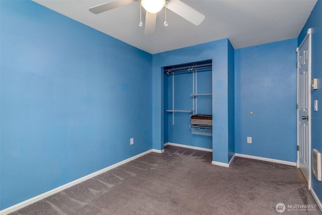unfurnished bedroom with carpet, a closet, a ceiling fan, and baseboards