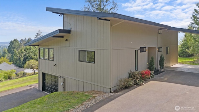 3837 Columbia Heights Rd, Longview, WA 98632 - view of side of property with an attached garage and aphalt driveway