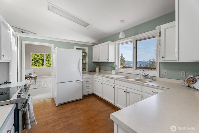 3837 Columbia Heights Rd, Longview, WA 98632 - kitchen featuring light countertops, freestanding refrigerator, white cabinetry, and stainless steel electric range oven
