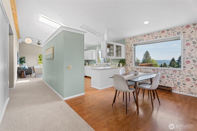 3837 Columbia Heights Rd, Longview, WA 98632 - dining room with light wood-type flooring, attic access, and wallpapered walls