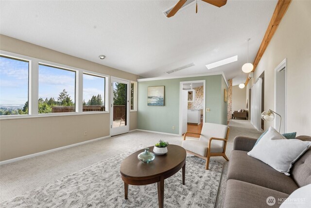 3837 Columbia Heights Rd, Longview, WA 98632 - carpeted living room with baseboards, a skylight, and ceiling fan