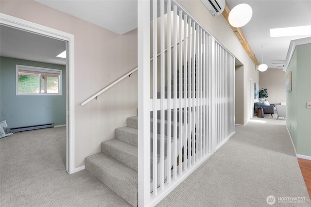 3837 Columbia Heights Rd, Longview, WA 98632 - stairs featuring carpet flooring, baseboards, a skylight, and a baseboard radiator