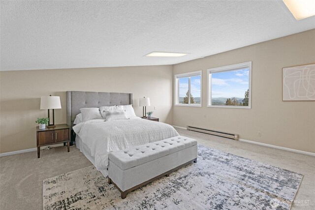 3837 Columbia Heights Rd, Longview, WA 98632 - carpeted bedroom with baseboards, a baseboard radiator, and a textured ceiling