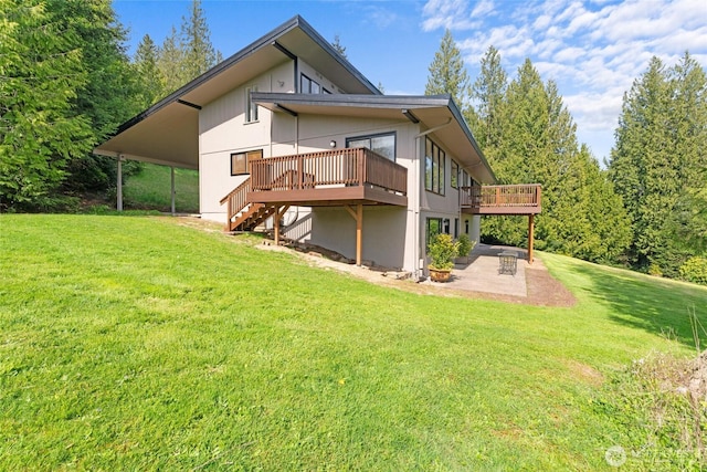3837 Columbia Heights Rd, Longview, WA 98632 - rear view of property featuring a yard, a wooden deck, stairs, and a patio