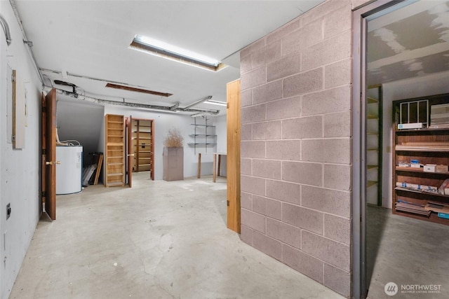 3837 Columbia Heights Rd, Longview, WA 98632 - basement featuring concrete block wall and water heater