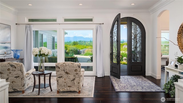 33 E Seashore Ln, Sequim, WA 98382 - entryway with hardwood / wood-style floors, arched walkways, and ornamental molding