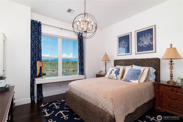 33 E Seashore Ln, Sequim, WA 98382 - bedroom with an inviting chandelier, dark wood-style flooring, visible vents, and baseboards