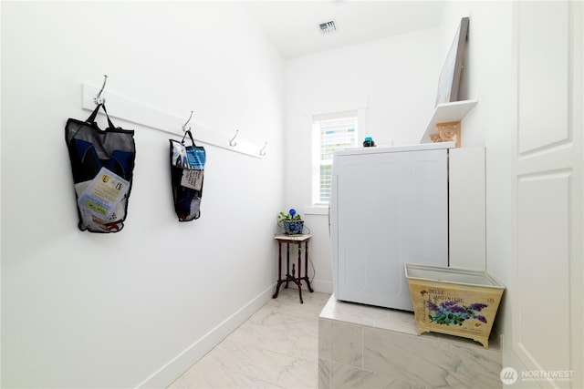 33 E Seashore Ln, Sequim, WA 98382 - doorway featuring baseboards, visible vents, marble finish floor, and washer / clothes dryer