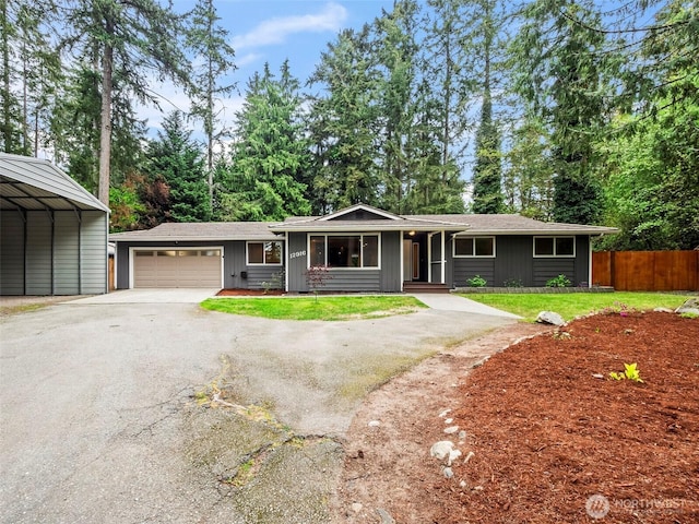 12916 97th Ave NW, Gig Harbor, WA 98329 - single story home with a garage, fence, a front yard, board and batten siding, and driveway
