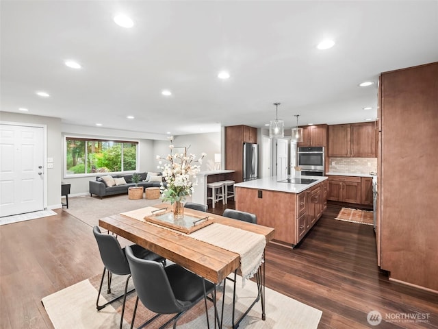 12916 97th Ave NW, Gig Harbor, WA 98329 - dining space featuring baseboards, recessed lighting, and dark wood-style floors