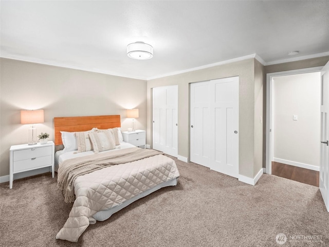 12916 97th Ave NW, Gig Harbor, WA 98329 - bedroom featuring crown molding, carpet floors, baseboards, and multiple closets