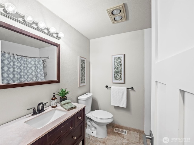 12916 97th Ave NW, Gig Harbor, WA 98329 - full bathroom with vanity, toilet, a shower with shower curtain, baseboards, and visible vents