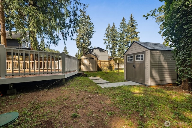 35622 4th Ave SW, Federal Way, WA 98023 - view of yard with an outdoor structure, a wooden deck, and a storage unit