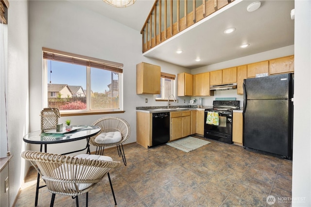 kitchen featuring light brown cabinets, a sink, black appliances, under cabinet range hood, and recessed lighting