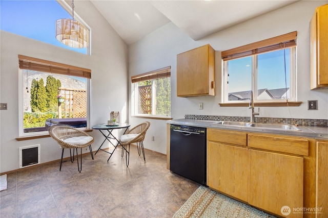 kitchen with dishwasher, a sink, baseboards, stainless steel counters, and high vaulted ceiling
