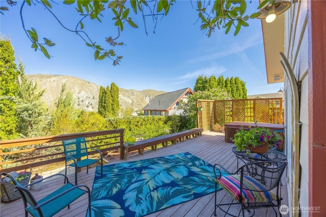 wooden terrace featuring a mountain view