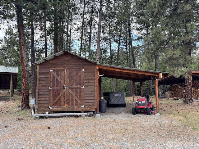 view of shed with a carport