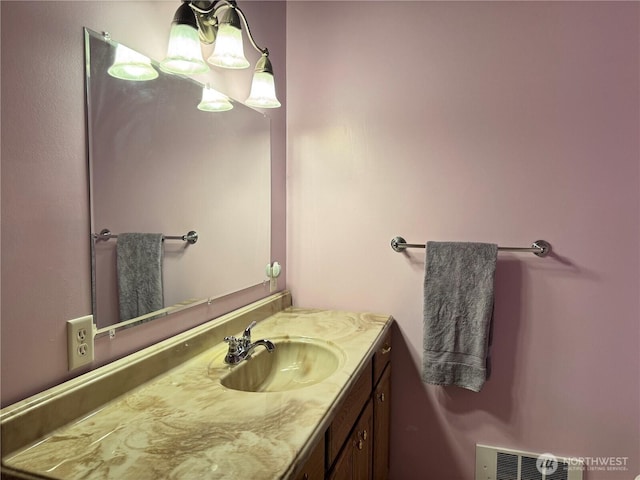 bathroom featuring visible vents and vanity