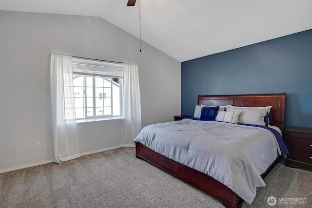 carpeted bedroom with baseboards, ceiling fan, and vaulted ceiling