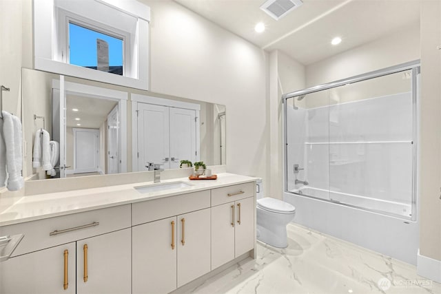 full bath with bath / shower combo with glass door, toilet, visible vents, marble finish floor, and vanity