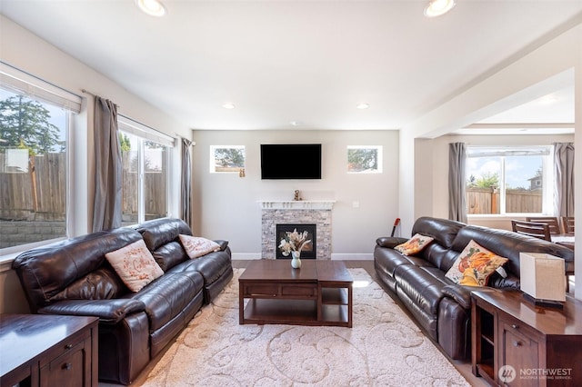 24524 96th Ave S, Kent, WA 98030 - living area with plenty of natural light, a fireplace, wood finished floors, recessed lighting, and baseboards