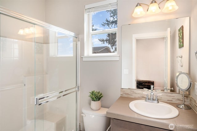 24524 96th Ave S, Kent, WA 98030 - bathroom featuring decorative backsplash, toilet, a shower stall, and vanity
