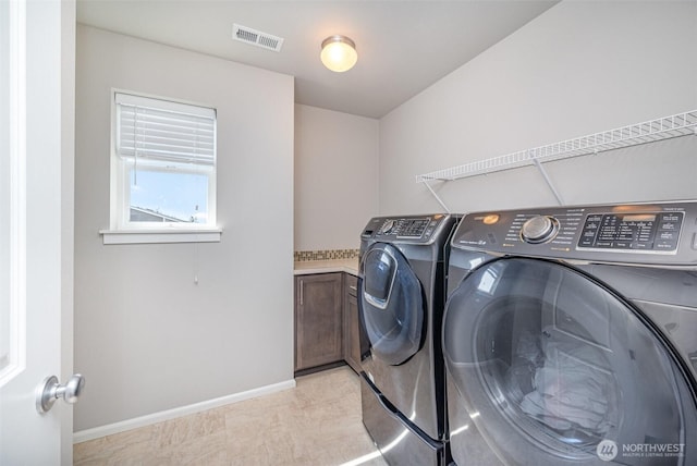 24524 96th Ave S, Kent, WA 98030 - laundry area featuring washing machine and clothes dryer and baseboards