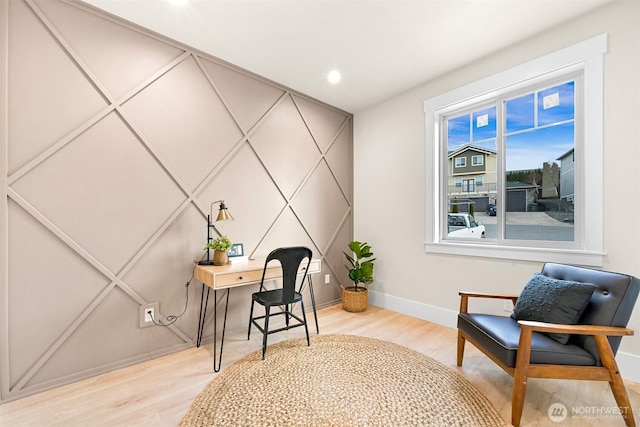 home office with baseboards and light wood-style floors