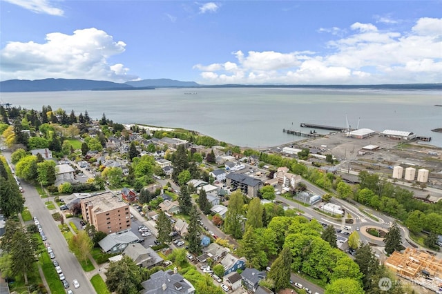drone / aerial view with a water and mountain view