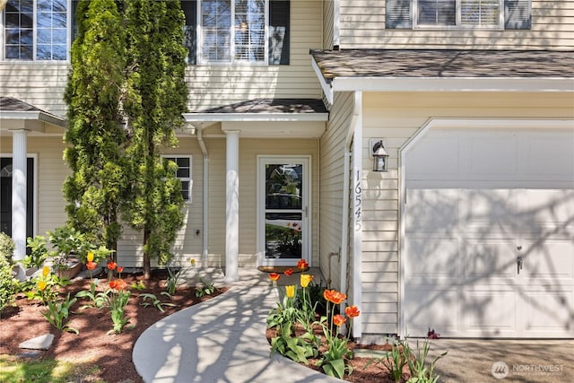 entrance to property with roof with shingles