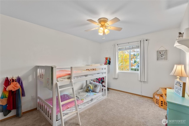 bedroom with baseboards, ceiling fan, and carpet flooring