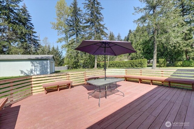 19802 118th Avenue Ct E, Graham, WA 98338 - wooden deck featuring view of wooded area and outdoor dining space