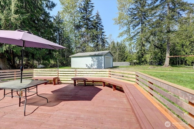 19802 118th Avenue Ct E, Graham, WA 98338 - deck with an outbuilding, a detached garage, and view of scattered trees