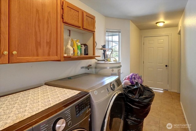 19802 118th Avenue Ct E, Graham, WA 98338 - laundry room featuring washing machine and dryer, cabinet space, and light tile patterned floors