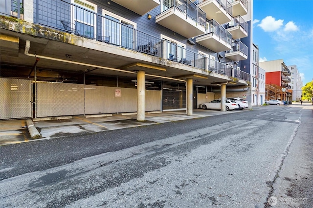 view of building exterior with covered parking