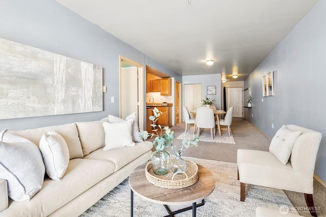 living area featuring light colored carpet