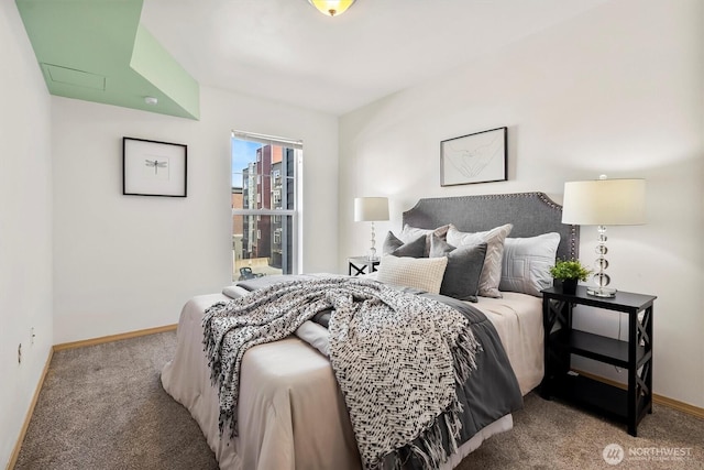 bedroom with baseboards and carpet