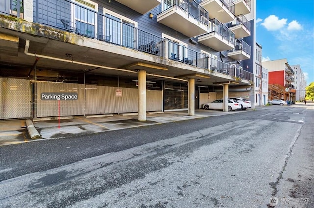 view of property featuring covered parking