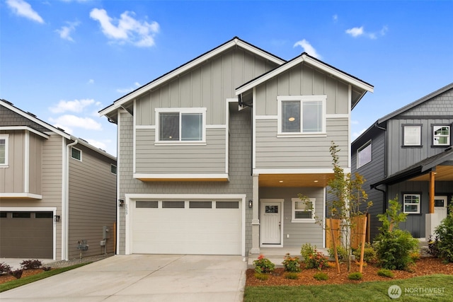 view of front of property featuring board and batten siding, concrete driveway, and an attached garage