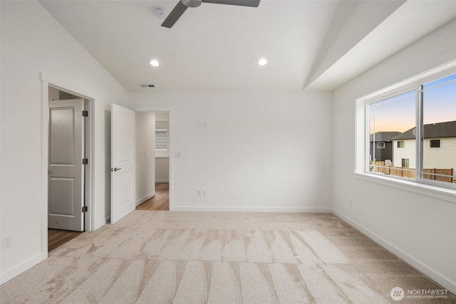carpeted empty room featuring recessed lighting, ceiling fan, and vaulted ceiling