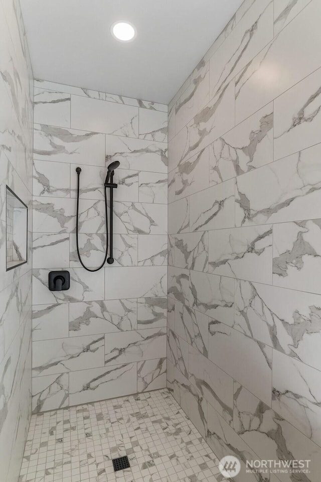 full bath with recessed lighting and a tile shower