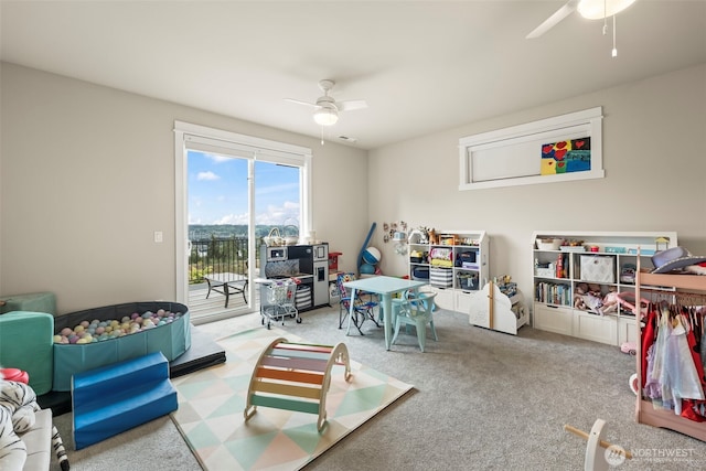 rec room featuring carpet floors and a ceiling fan