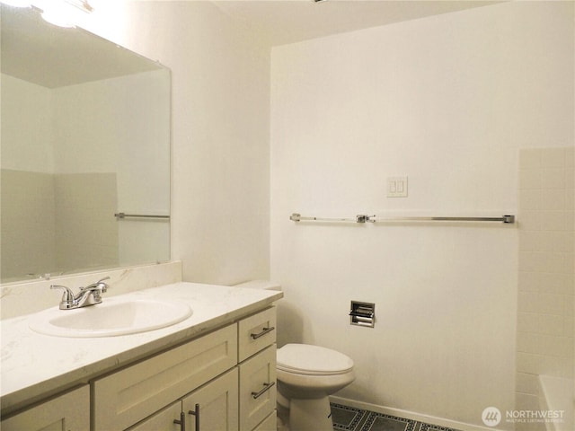 full bathroom featuring tile patterned flooring, vanity, toilet, a tub to relax in, and visible vents