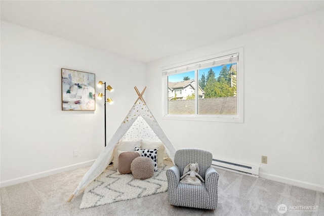 playroom with a baseboard heating unit, baseboards, and carpet flooring
