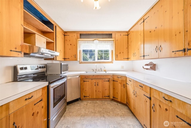 kitchen featuring stainless steel appliances, open shelves, under cabinet range hood, light countertops, and a sink